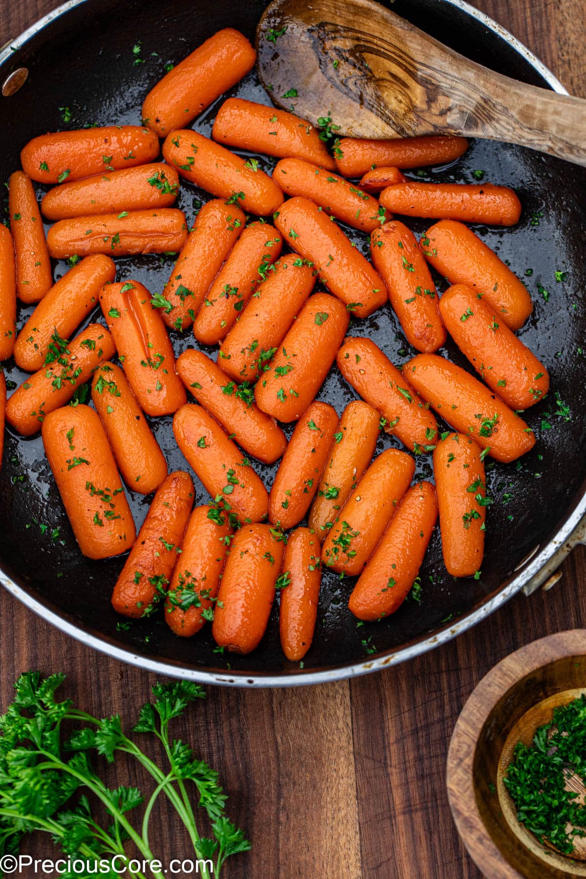 Glazed carrots garnished with fresh parsley.