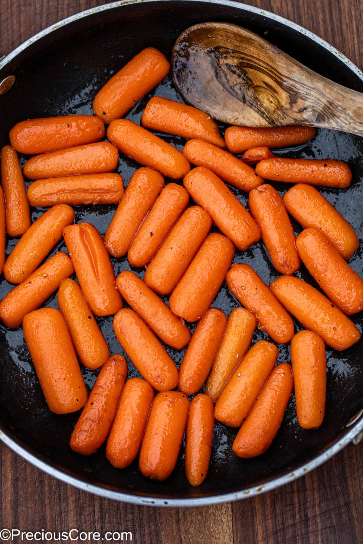 Honey glazed carrots in skillet.