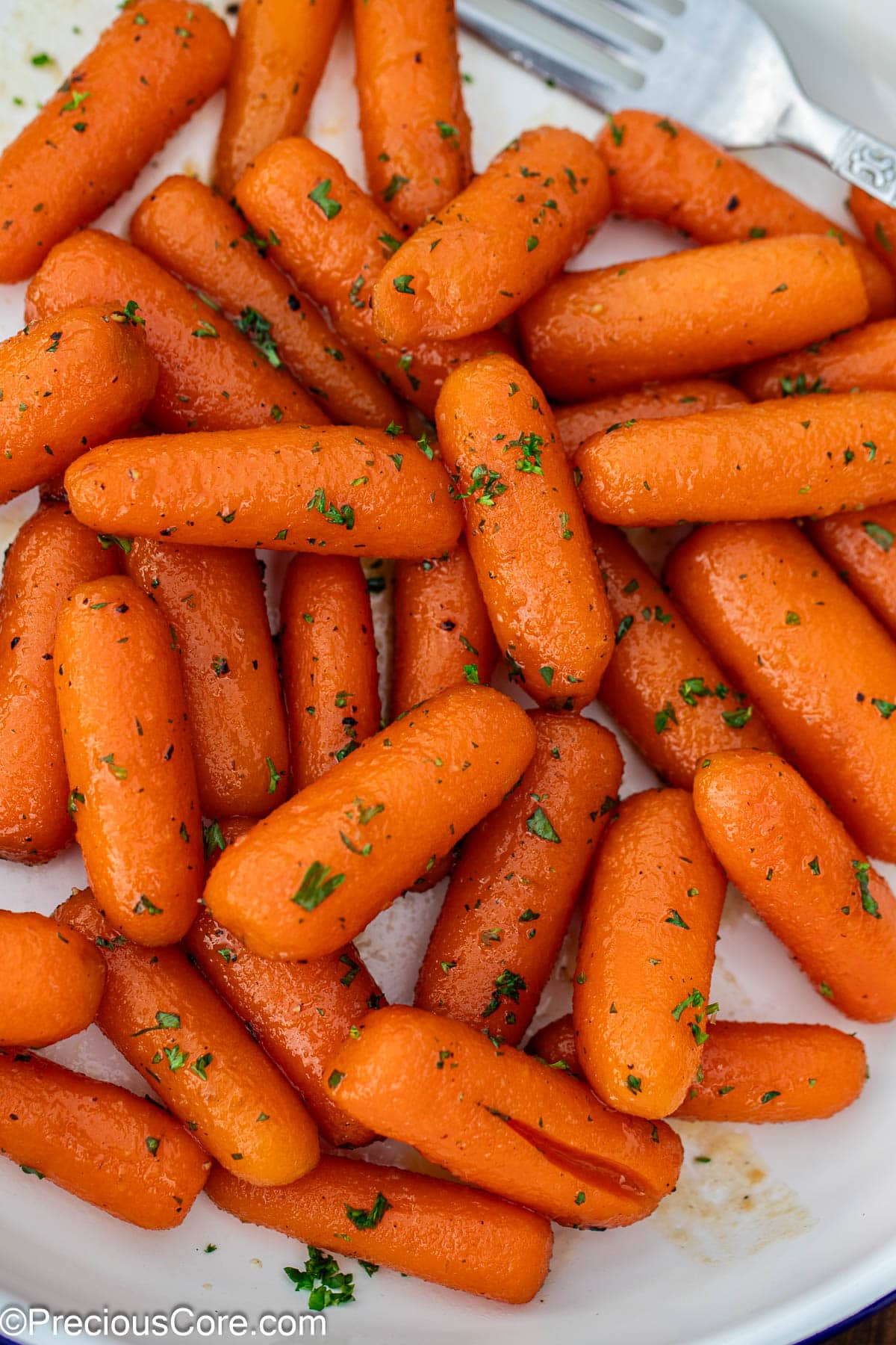 Brown sugar honey glazed carrots on a plate.