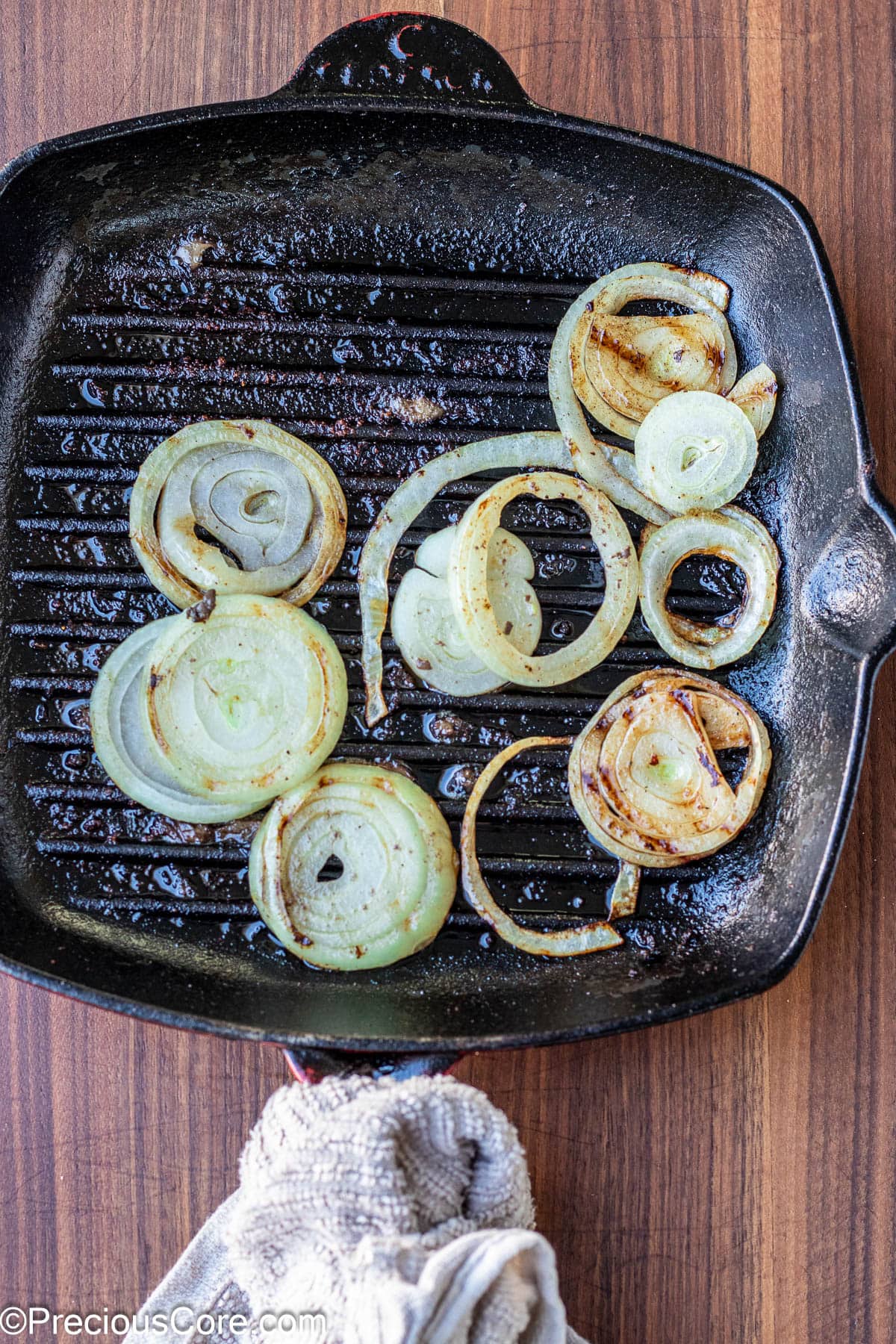 Grilled onions in a grill pan.