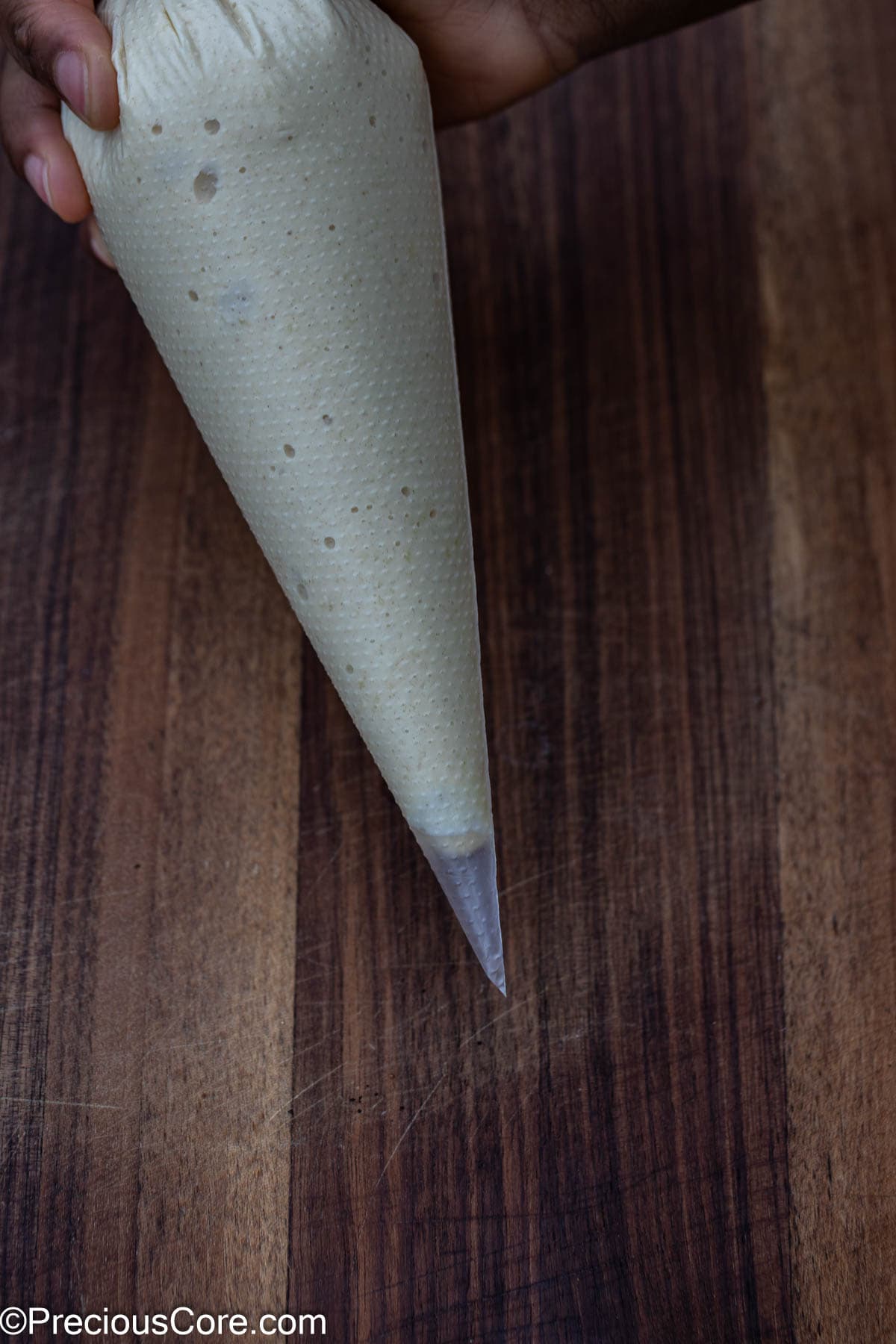 Pancake batter in a piping bag.