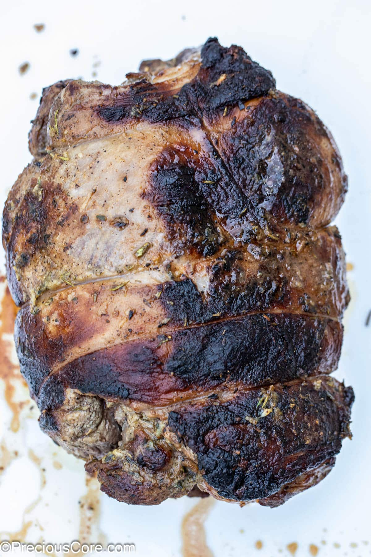 Whole roasted boneless leg of lamb.