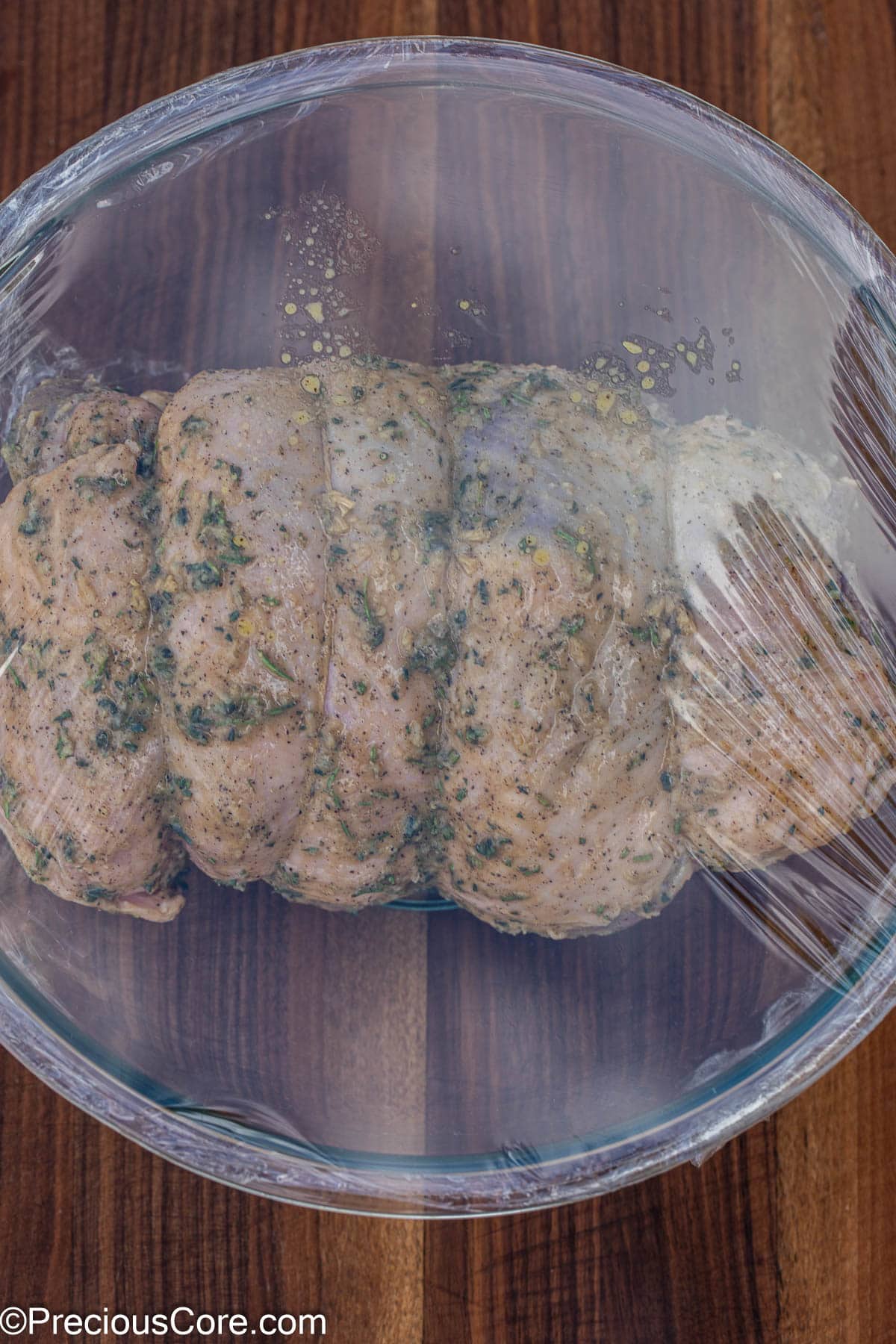 Lamb marinating in mixing bowl.