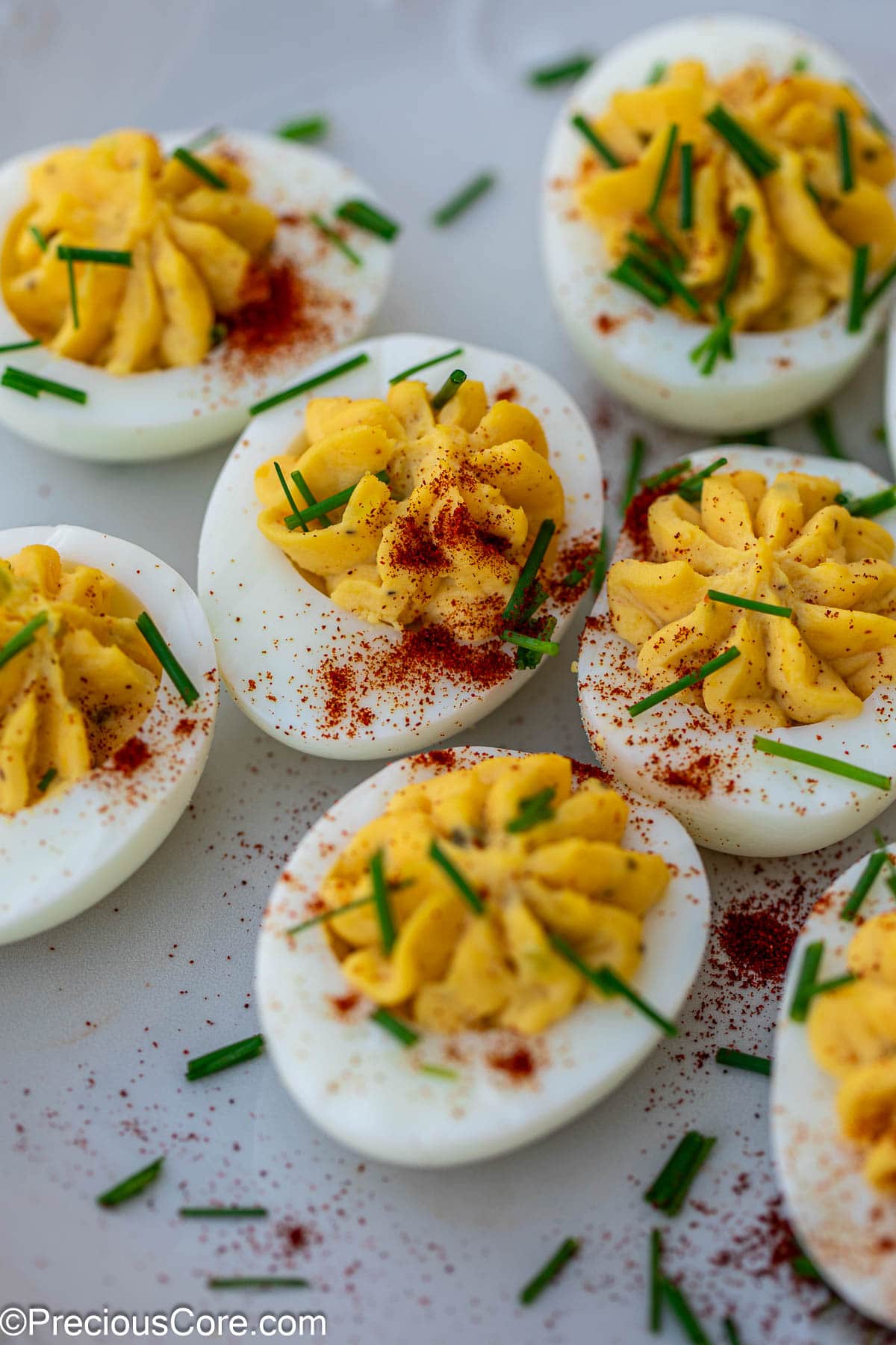Deviled eggs with toppings.