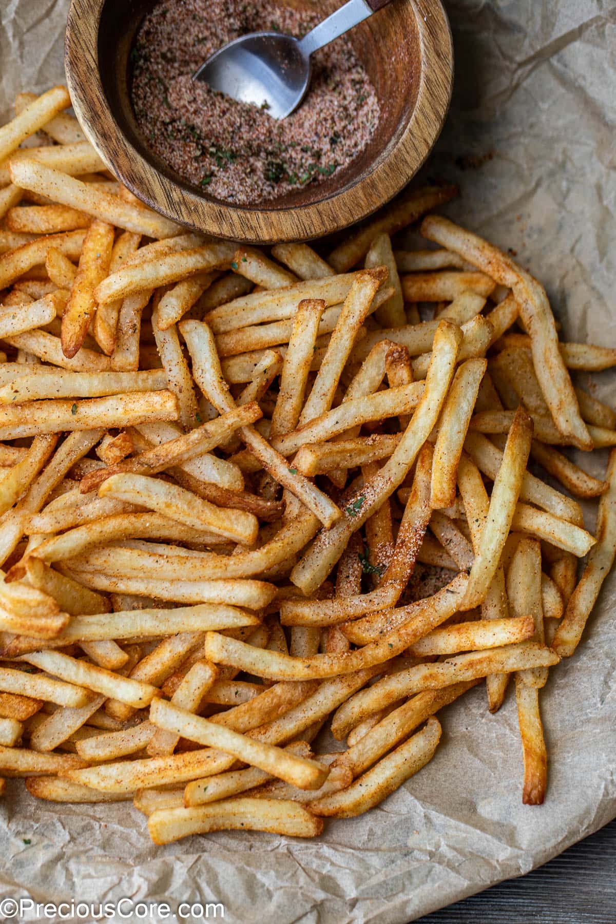 Close-up of seasoned French fries.