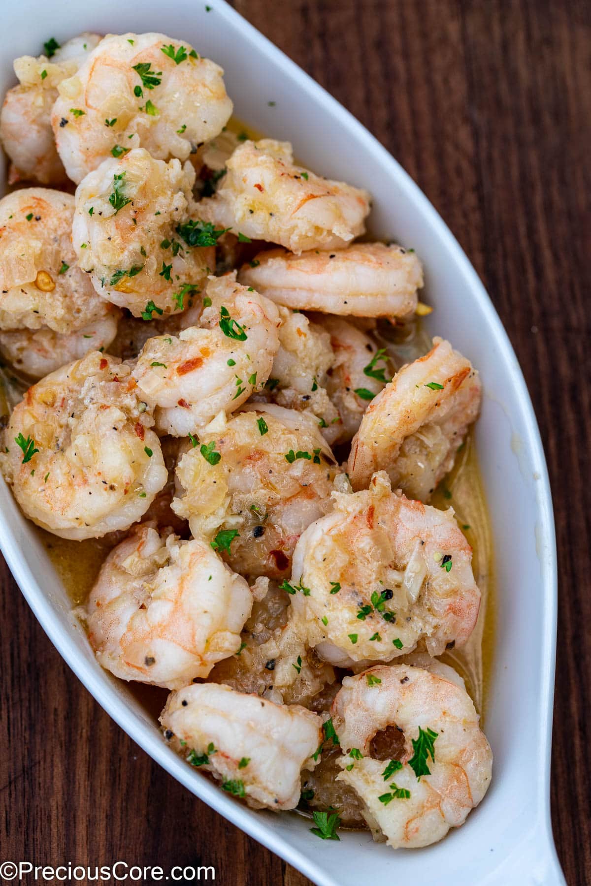 Shrimp served in a small white serving bowl.