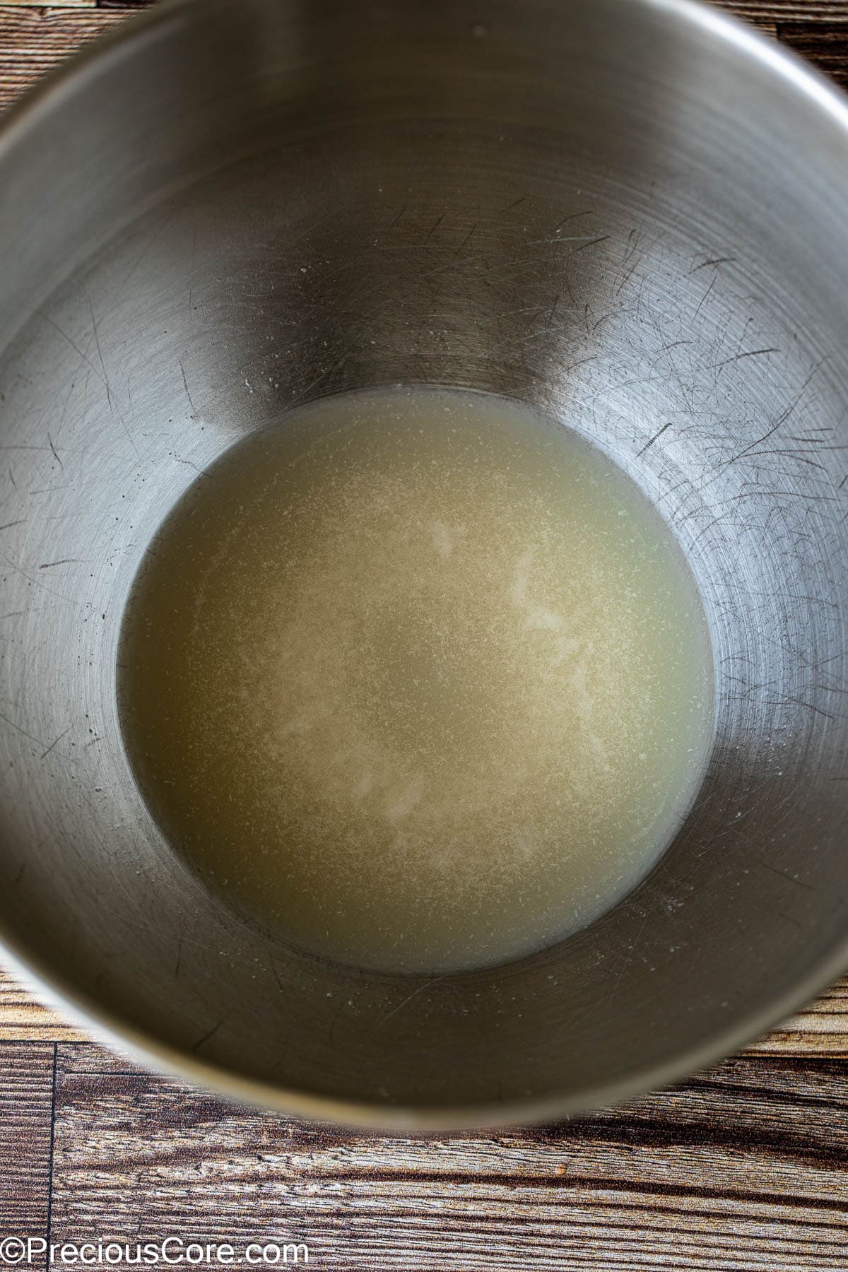 Warm water and yeast in a mixing bowl.