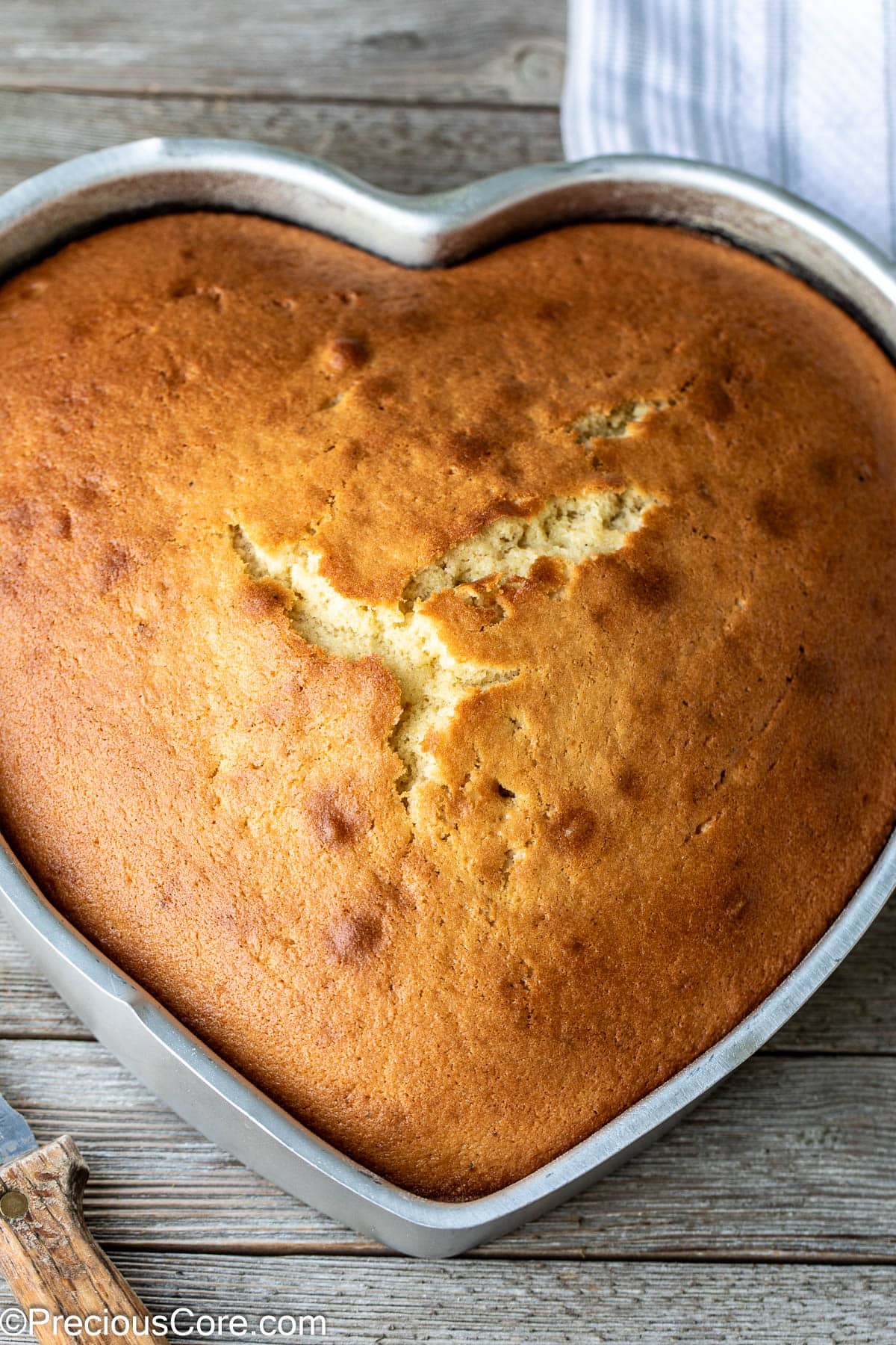 Heart shaped plain cake in the pan.