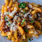 Image of loaded fries with text, "loaded french fries with bacon and cheese".