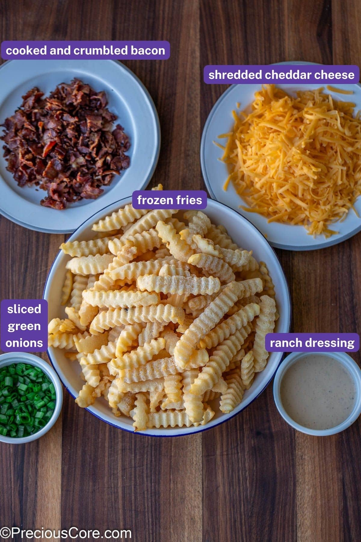 Ingredients for loaded fries with labels on them.