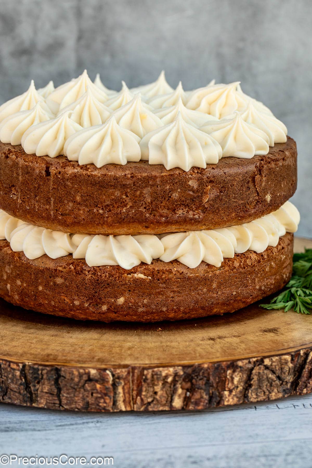 Decorated carrot cake with cream cheese frosting.