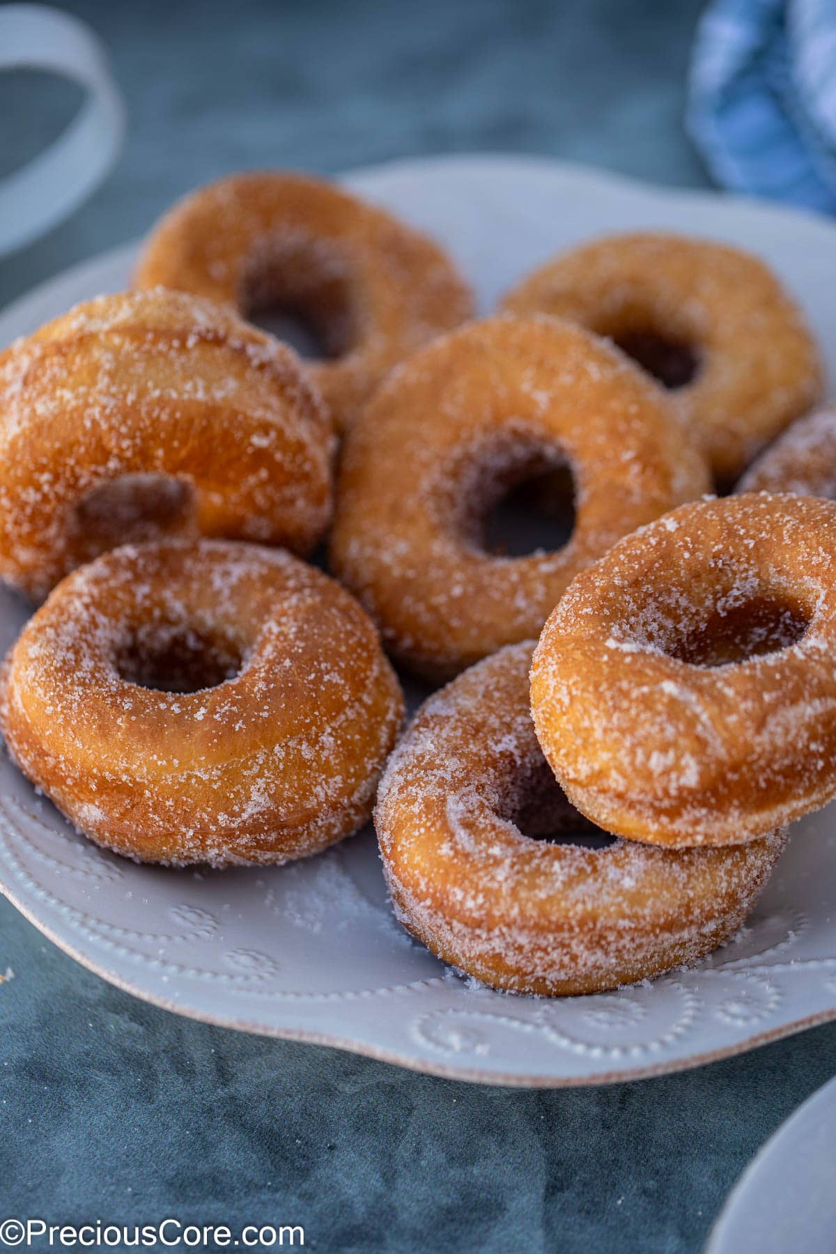 Doughnuts on a white plate.