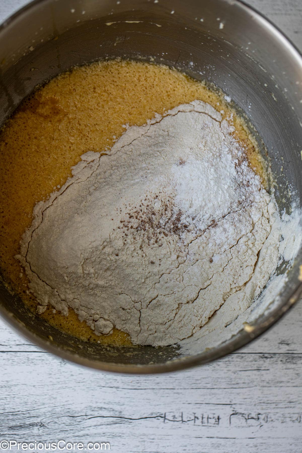 Dry ingredients added to cake batter.