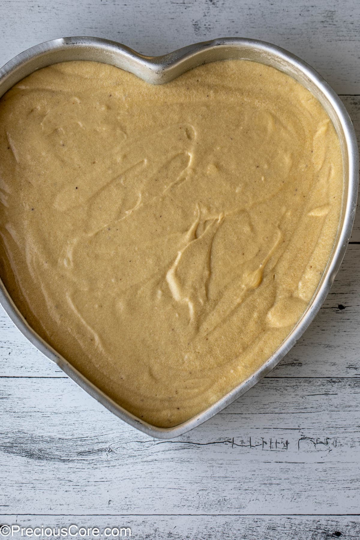 Cake batter in a heart-shaped pan.