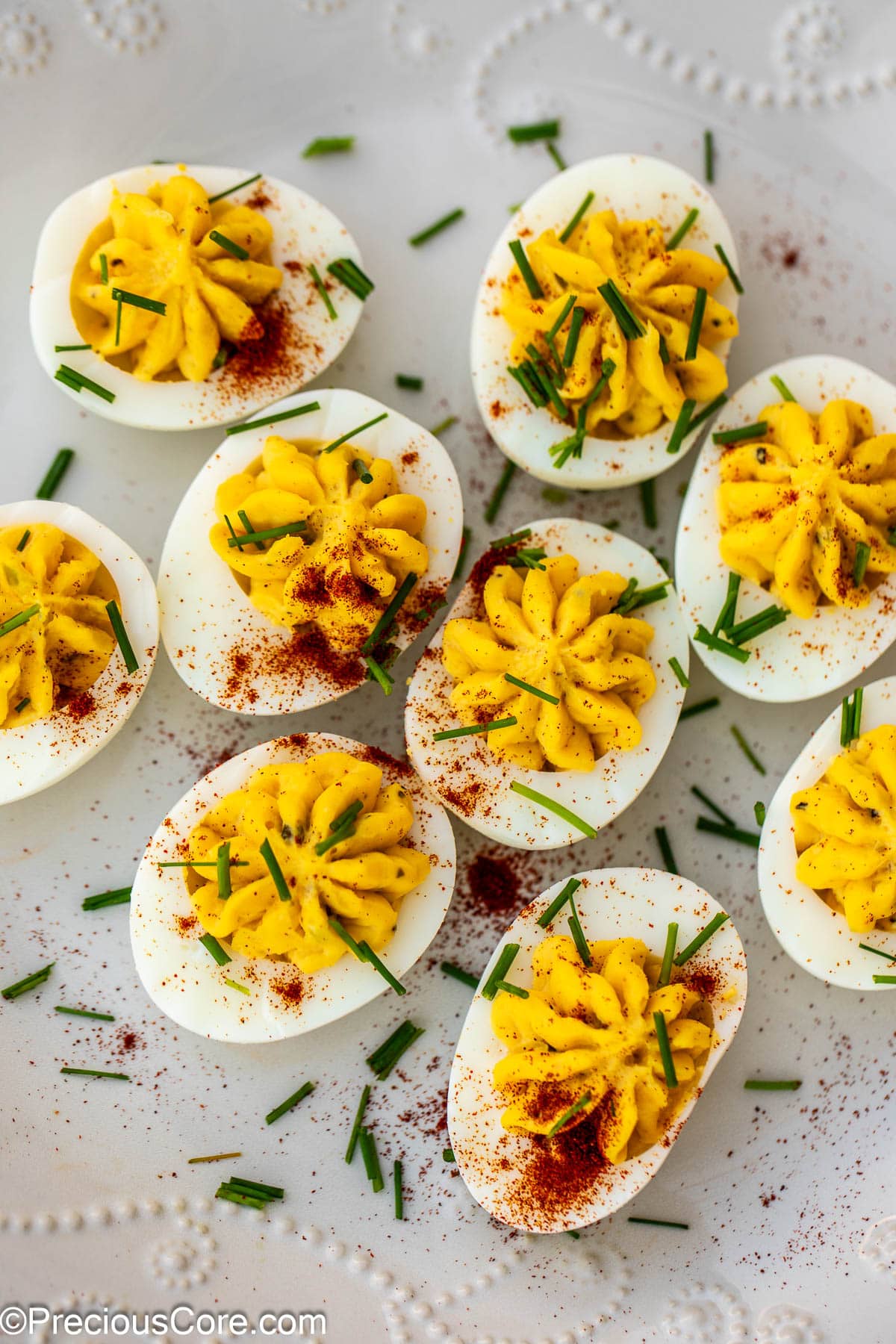 Deviled eggs with paprika and herbs.