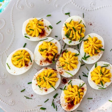 Deviled eggs with paprika and herbs.