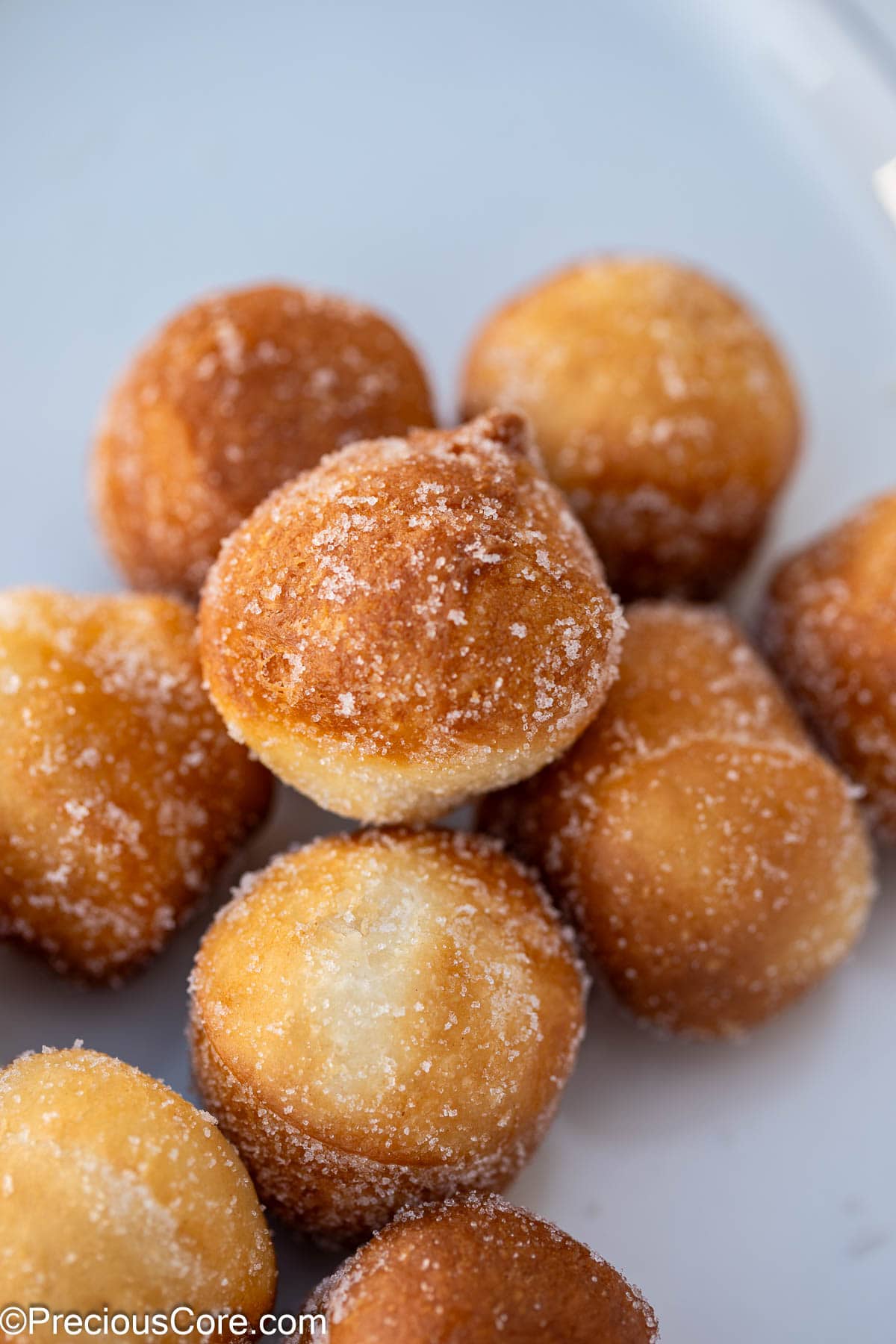 Donut holes coated with sugar.