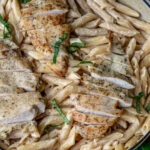 Creamy garlic parmesan pasta topped with chicken.