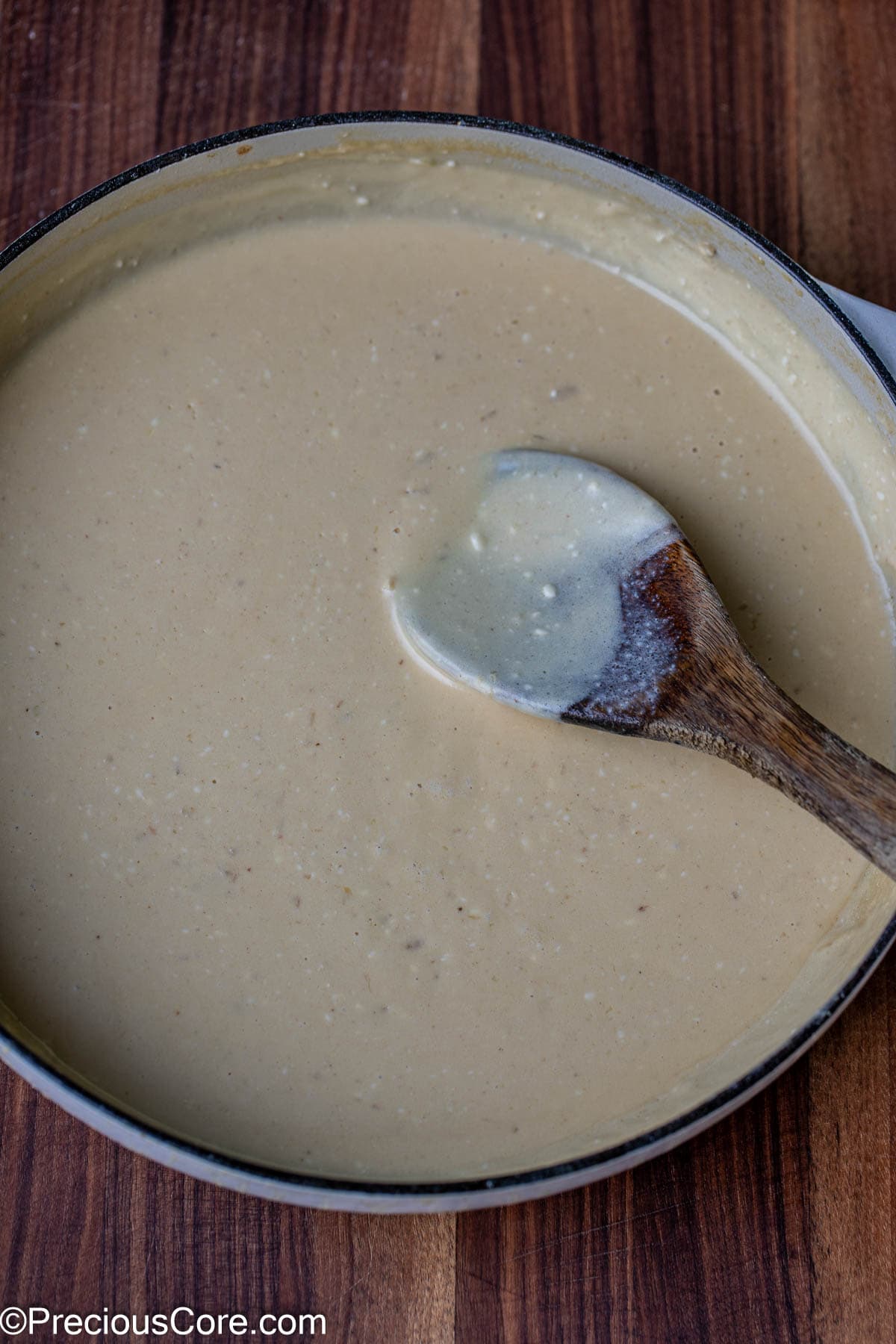 Creamy white sauce in a pot.