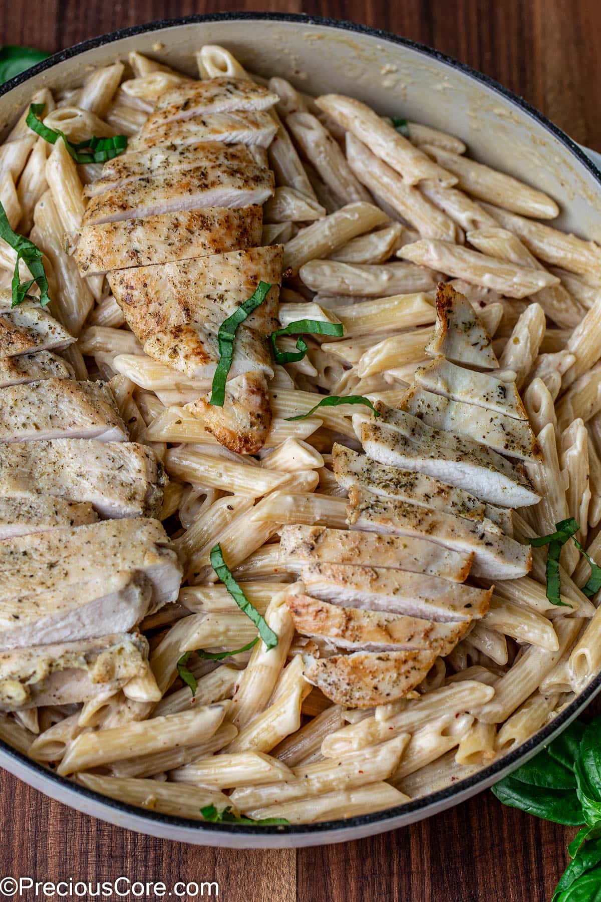 Creamy garlic parmesan pasta topped with chicken.