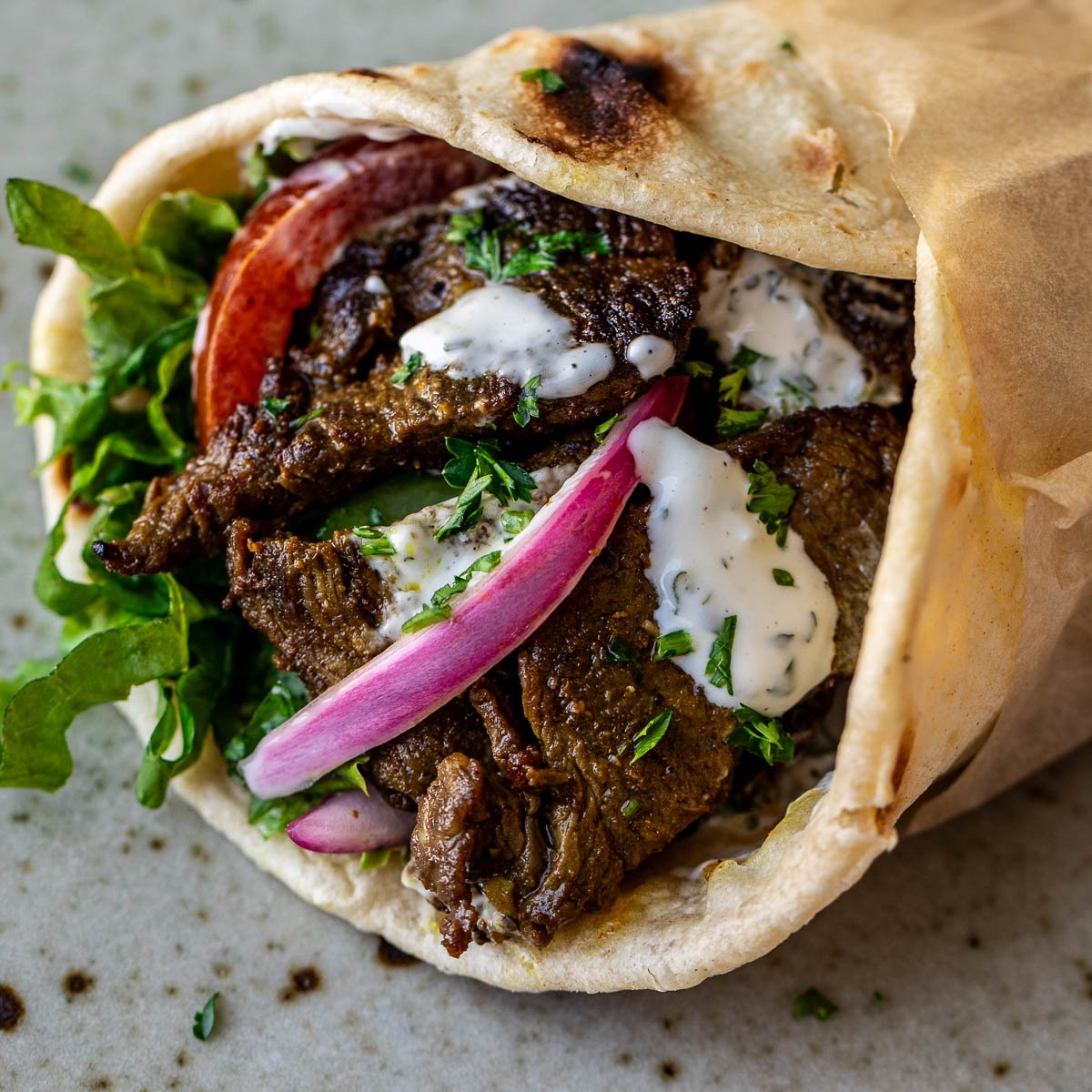 Close up image of beef shawarma wrap.