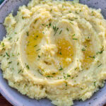 Bowl of mashed white sweet potatoes.