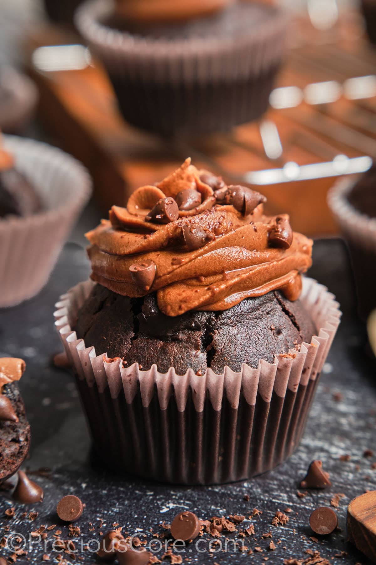 Zoom-in on a chocolate cupcake with chocolate frosting.